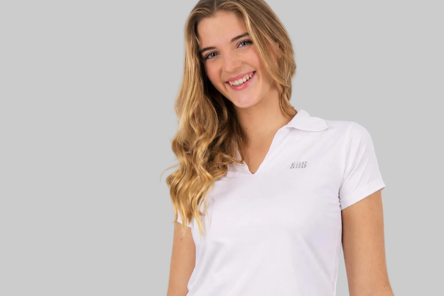 Polo femenino de material técnico fabricado en barcelona